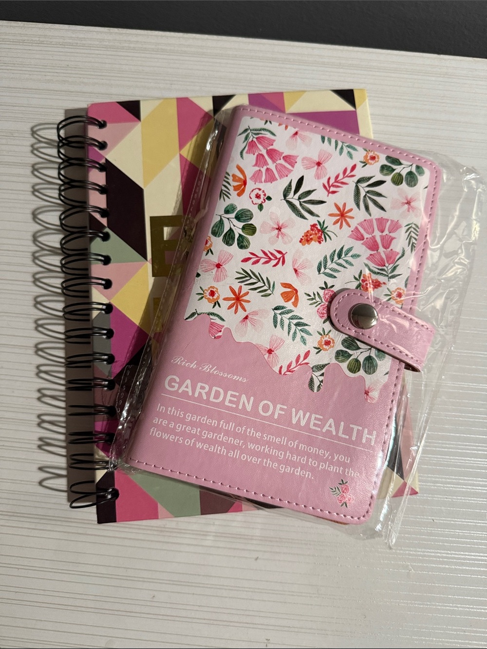 Garden of wealth and notebook for big ideas. The money saver notebook is new